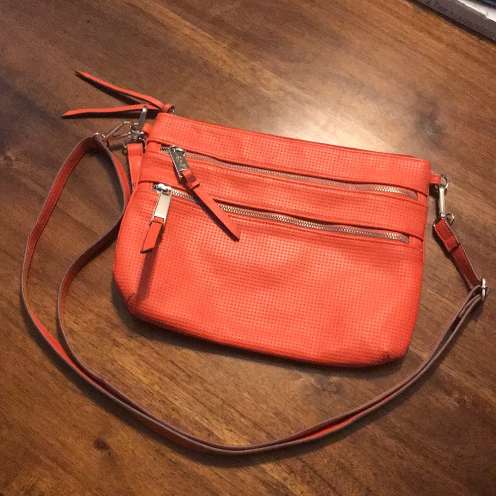Coral orange Jessica Simpson purse needs cleaned